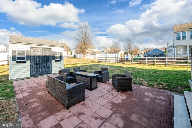 a front view of house with yard having outdoor seating