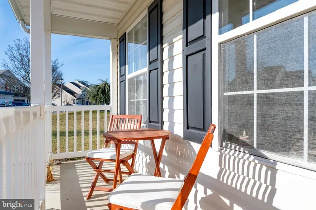 a view of a porch with a floor to ceiling window