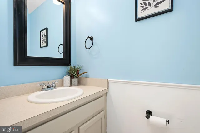 a bathroom with a sink and mirror