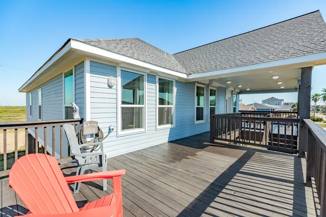 a view of a balcony with wooden floor