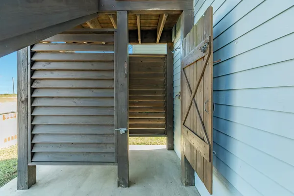a view of an chairs and door in the house