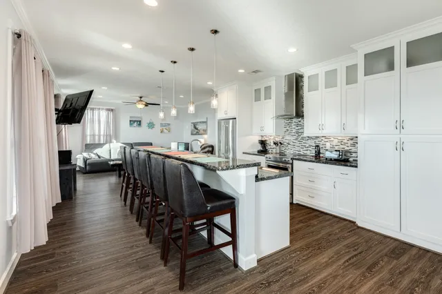 a kitchen with stove and cabinets