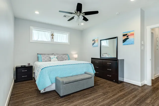 a spacious bedroom with a bed and a view of bathroom