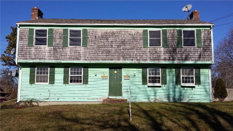 149 Seabrook Road, Unit 1 & 2 Hyannis, MA 02601 - Photo 1 of 16 a front view of a house with glass windows