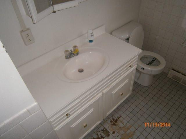 149 Seabrook Road, Unit 1 & 2 Hyannis, MA 02601 - Photo 11 of 16 a bathroom with a sink and toilet