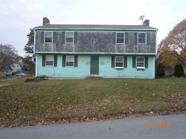 149 Seabrook Road, Unit 1 & 2 Hyannis, MA 02601 - Photo 2 of 16 a front view of a house with garden