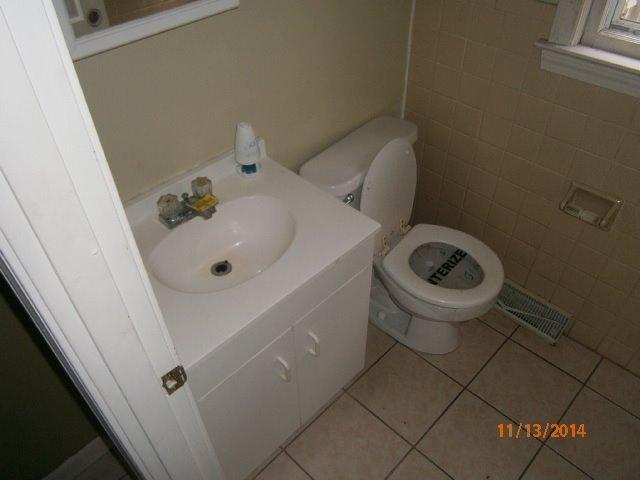 149 Seabrook Road, Unit 1 & 2 Hyannis, MA 02601 - Photo 3 of 16 a bathroom with a sink and toilet