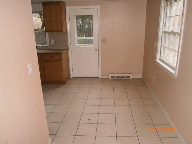 149 Seabrook Road, Unit 1 & 2 Hyannis, MA 02601 - Photo 9 of 16 an empty room with windows