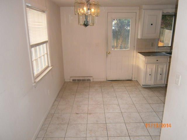 149 Seabrook Road, Unit 1 & 2 Hyannis, MA 02601 - Photo 10 of 16 an empty room with windows and entrance
