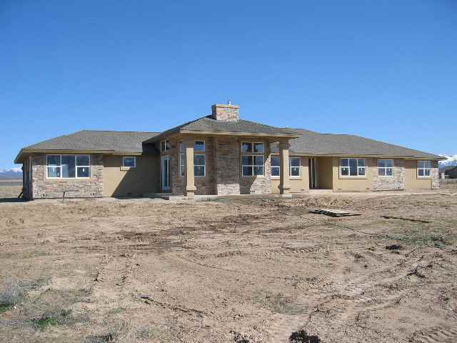 1699 North Benton Road Minden, NV 89423 - Photo 1 of 3 a front view of a house with a space