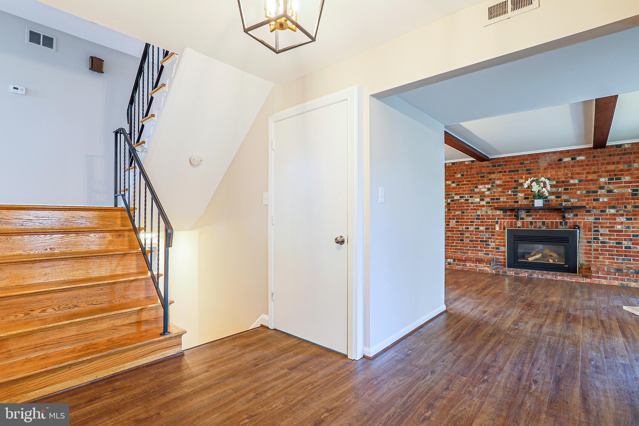 319 Summit Hall Road Gaithersburg, MD 20877 - Photo 22 of 58 Entryway looks on to living room w/ fireplace!