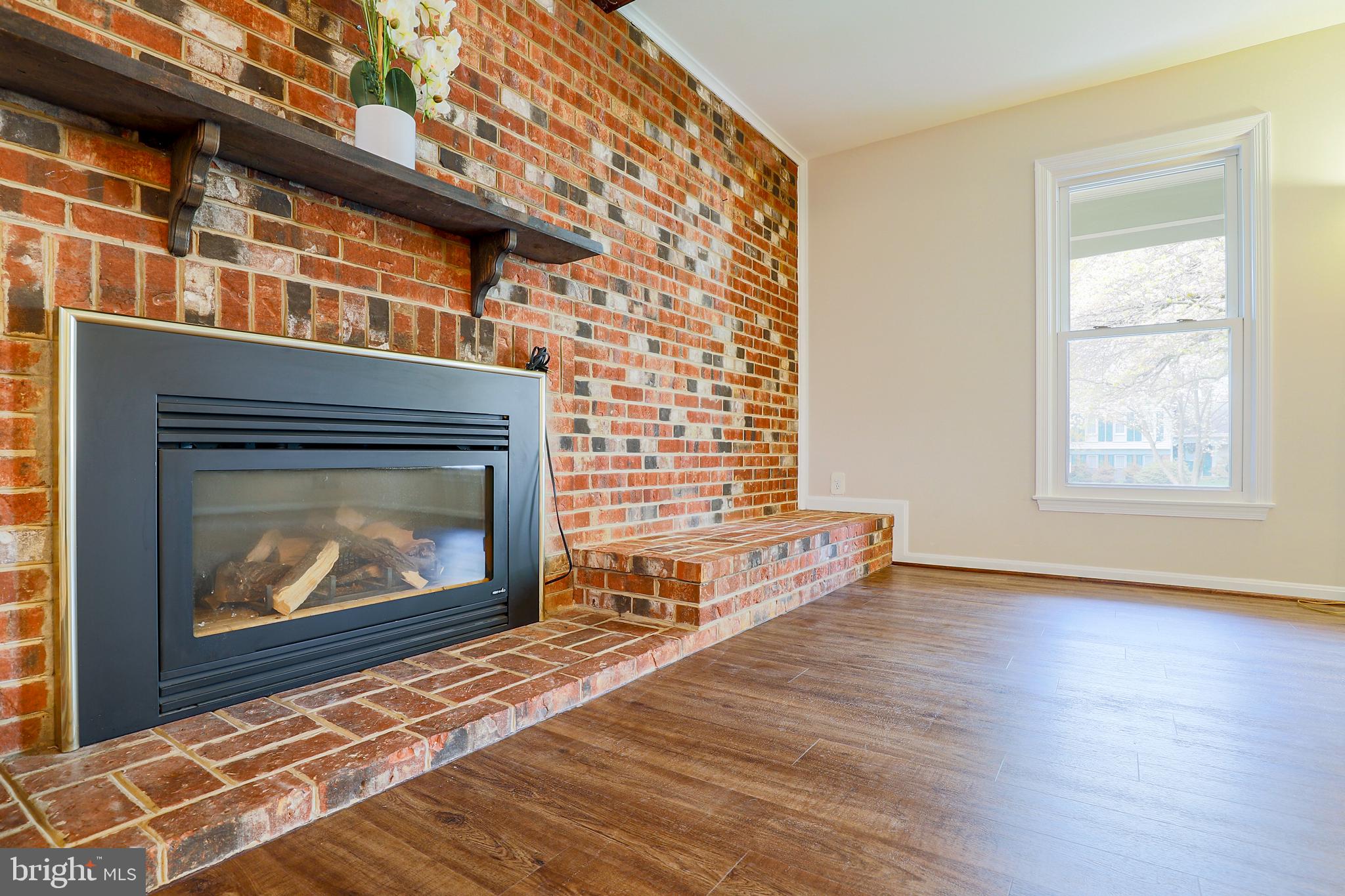 319 Summit Hall Road Gaithersburg, MD 20877 - Photo 23 of 58 Living room with fireplace! New Floors! Light!