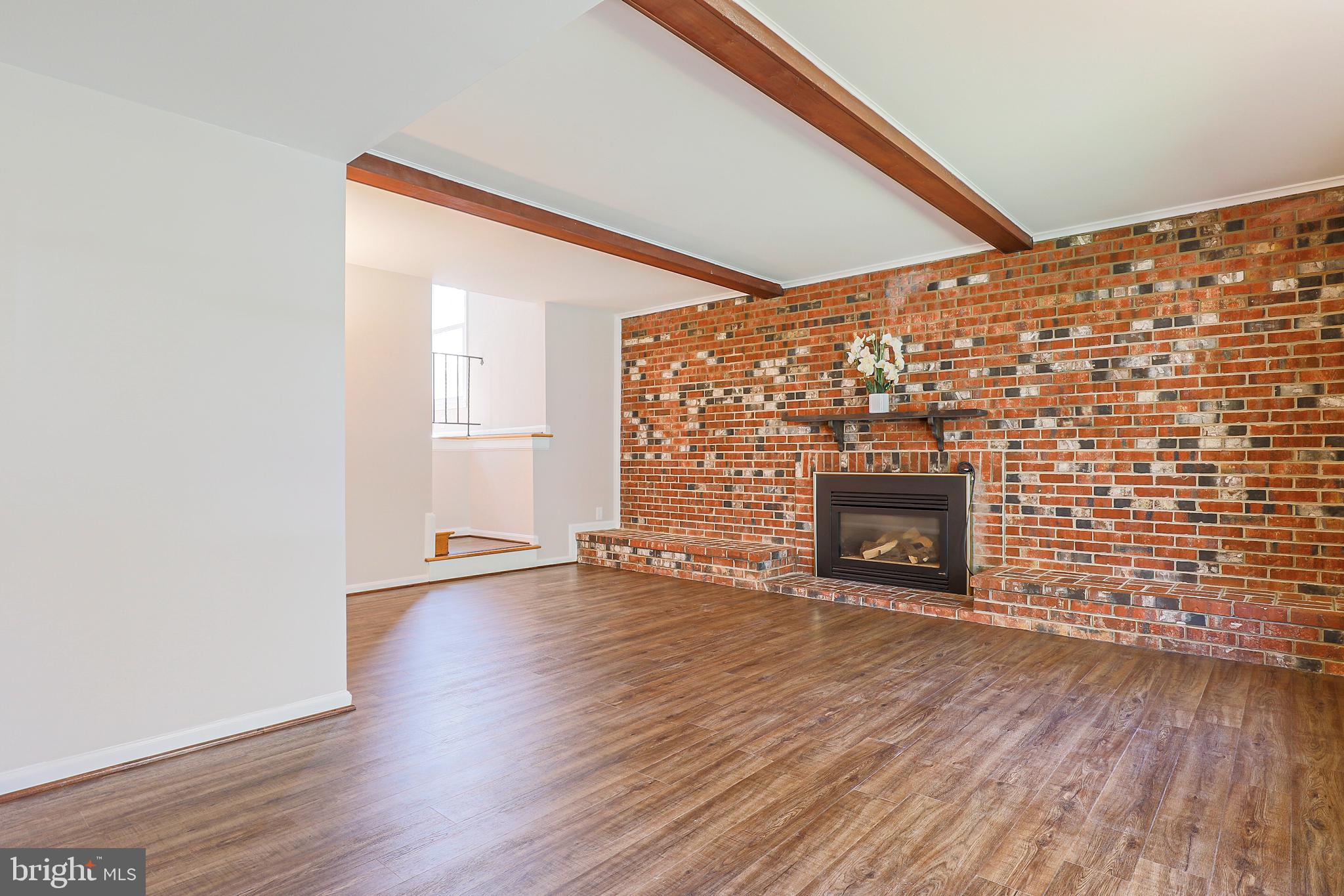 319 Summit Hall Road Gaithersburg, MD 20877 - Photo 31 of 58 Exposed brick w/ gas insert fireplace!