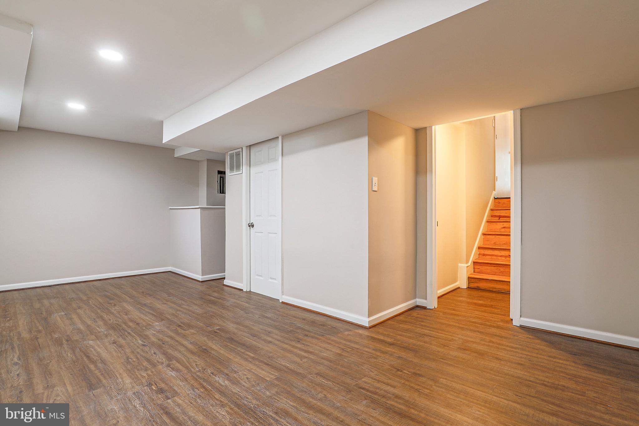 319 Summit Hall Road Gaithersburg, MD 20877 - Photo 50 of 58 Lower level with new flooring and mini bar!