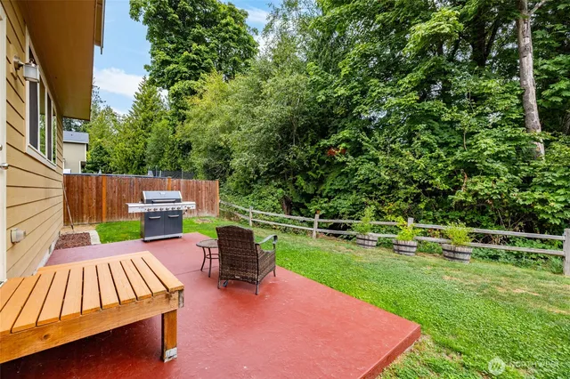 a view of a backyard with sitting area
