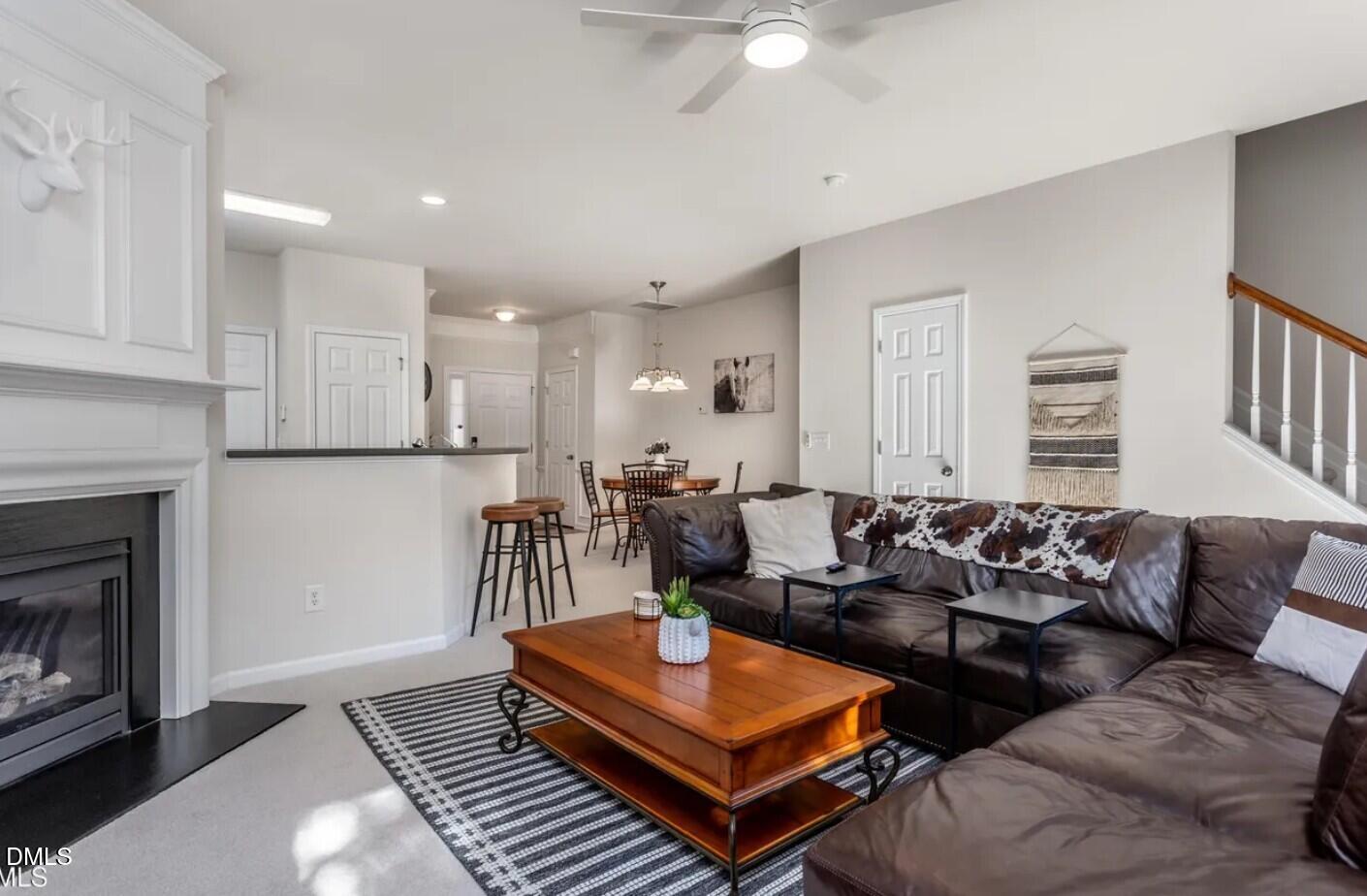 7031 Racine Way Raleigh, NC 27615 - Photo 11 of 24 a living room with furniture and a fireplace