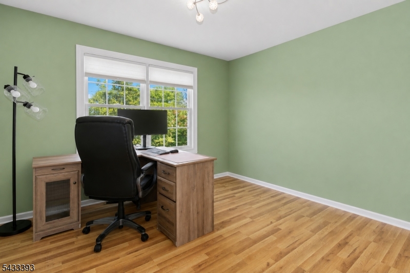 33 Stanton Street Clark, NJ 07066 - Photo 29 of 37 a view of a workspace with furniture and a window