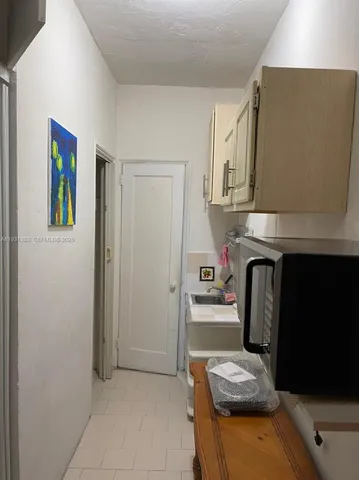 a kitchen with stainless steel appliances granite countertop a refrigerator and a stove