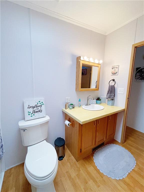 121 Mountain View Drive Berlin, PA 15530 - Photo 24 of 36 a bathroom with a toilet a sink and a mirror