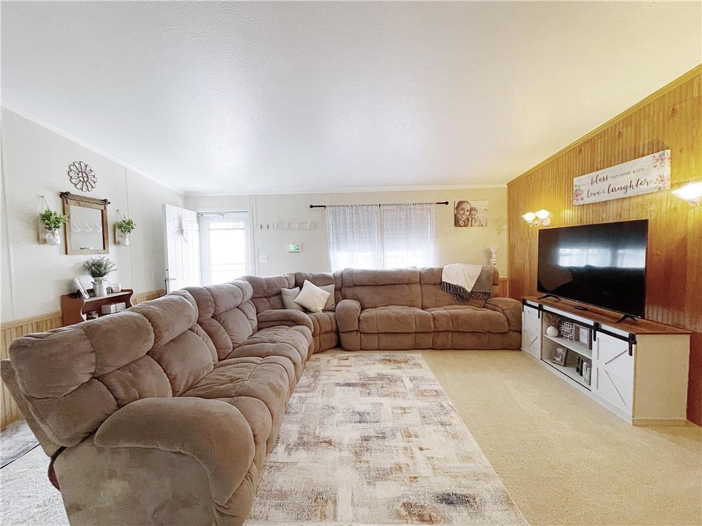 121 Mountain View Drive Berlin, PA 15530 - Photo 4 of 36 a living room with furniture and a flat screen tv
