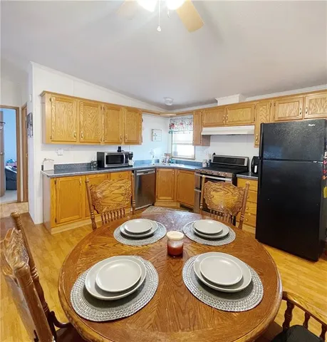 a kitchen with a table chairs and a stove