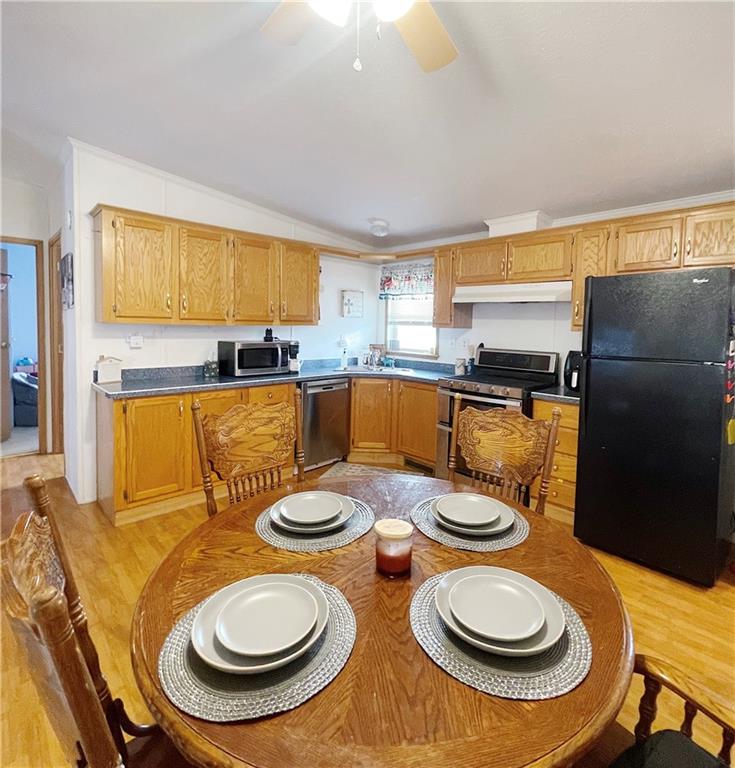 121 Mountain View Drive Berlin, PA 15530 - Photo 9 of 36 a kitchen with a table chairs and a stove