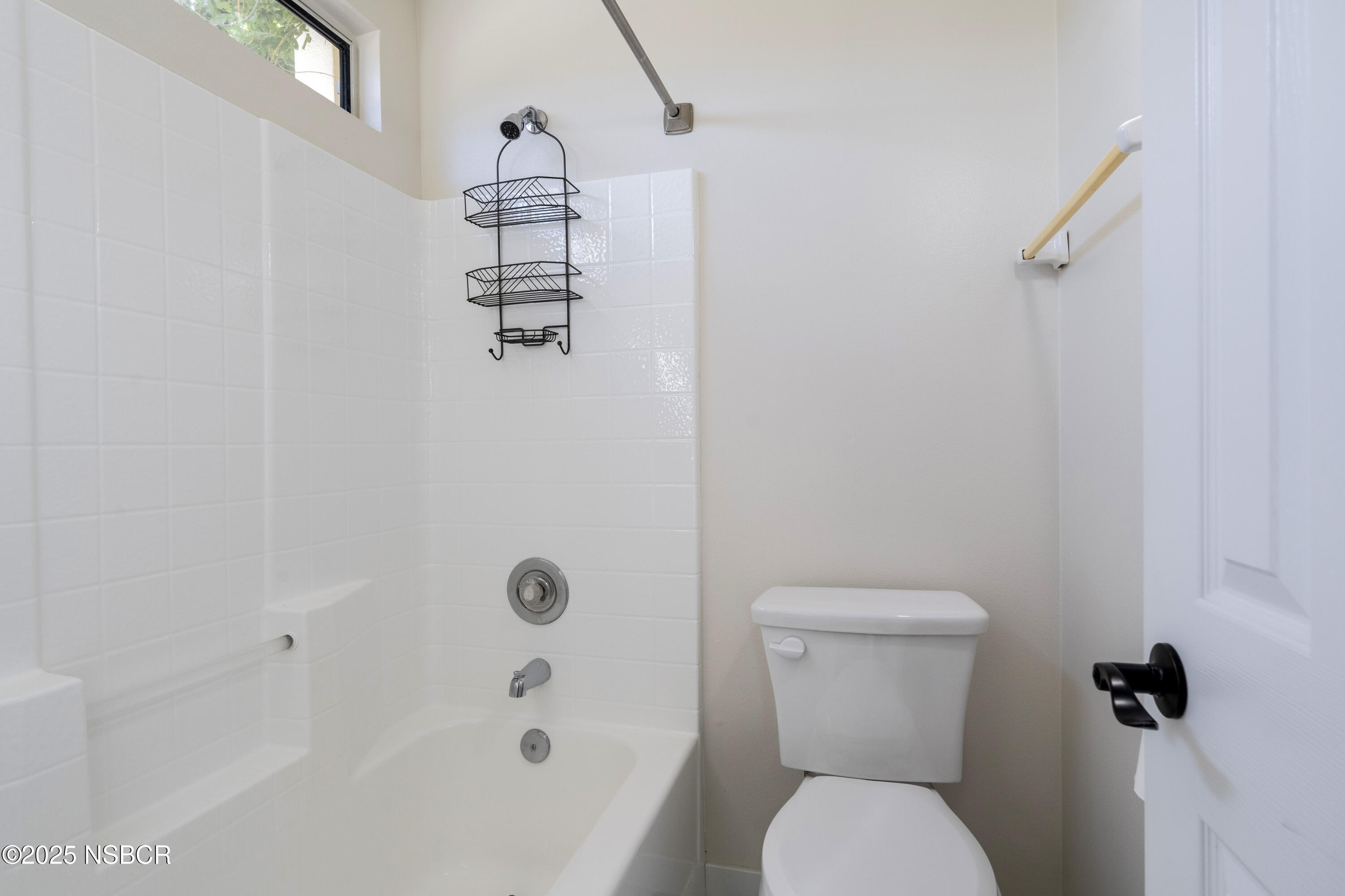 576 Pine Street, Unit A Solvang, CA 93463 - Photo 16 of 19 a bathroom with a shower a toilet and a sink