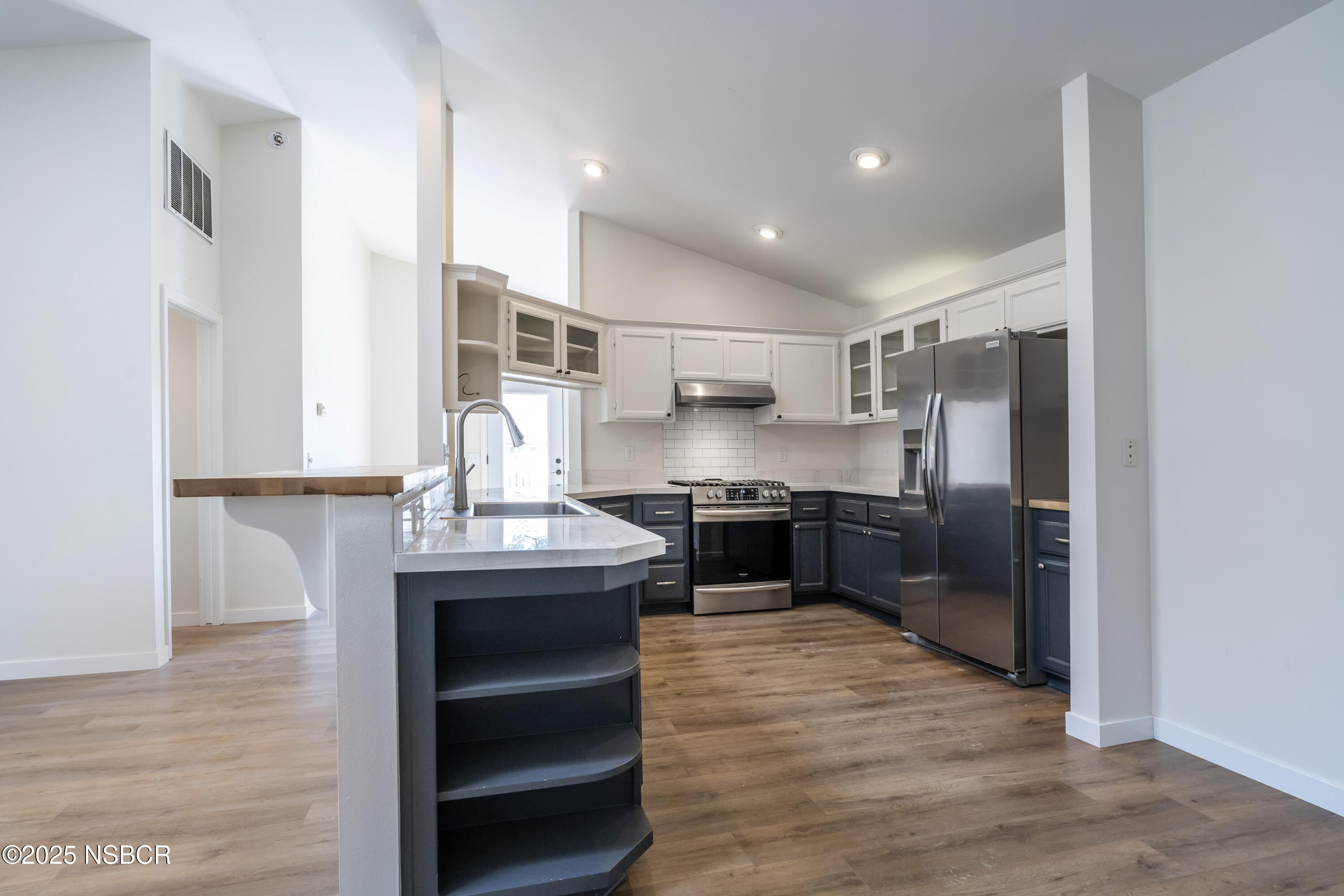 576 Pine Street, Unit A Solvang, CA 93463 - Photo 3 of 19 a kitchen with stainless steel appliances granite countertop a sink refrigerator and cabinets