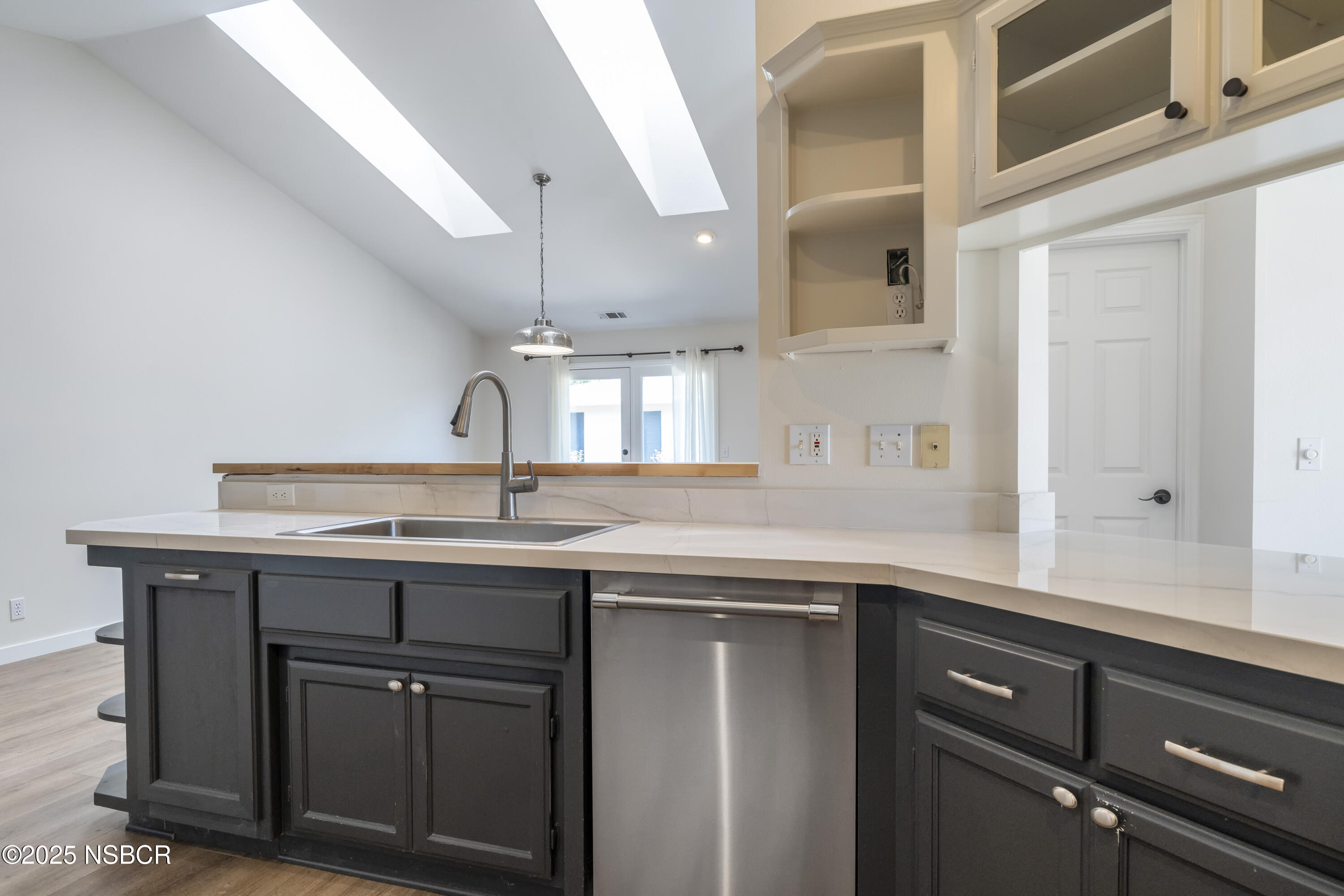 576 Pine Street, Unit A Solvang, CA 93463 - Photo 4 of 19 a kitchen with a sink and cabinets