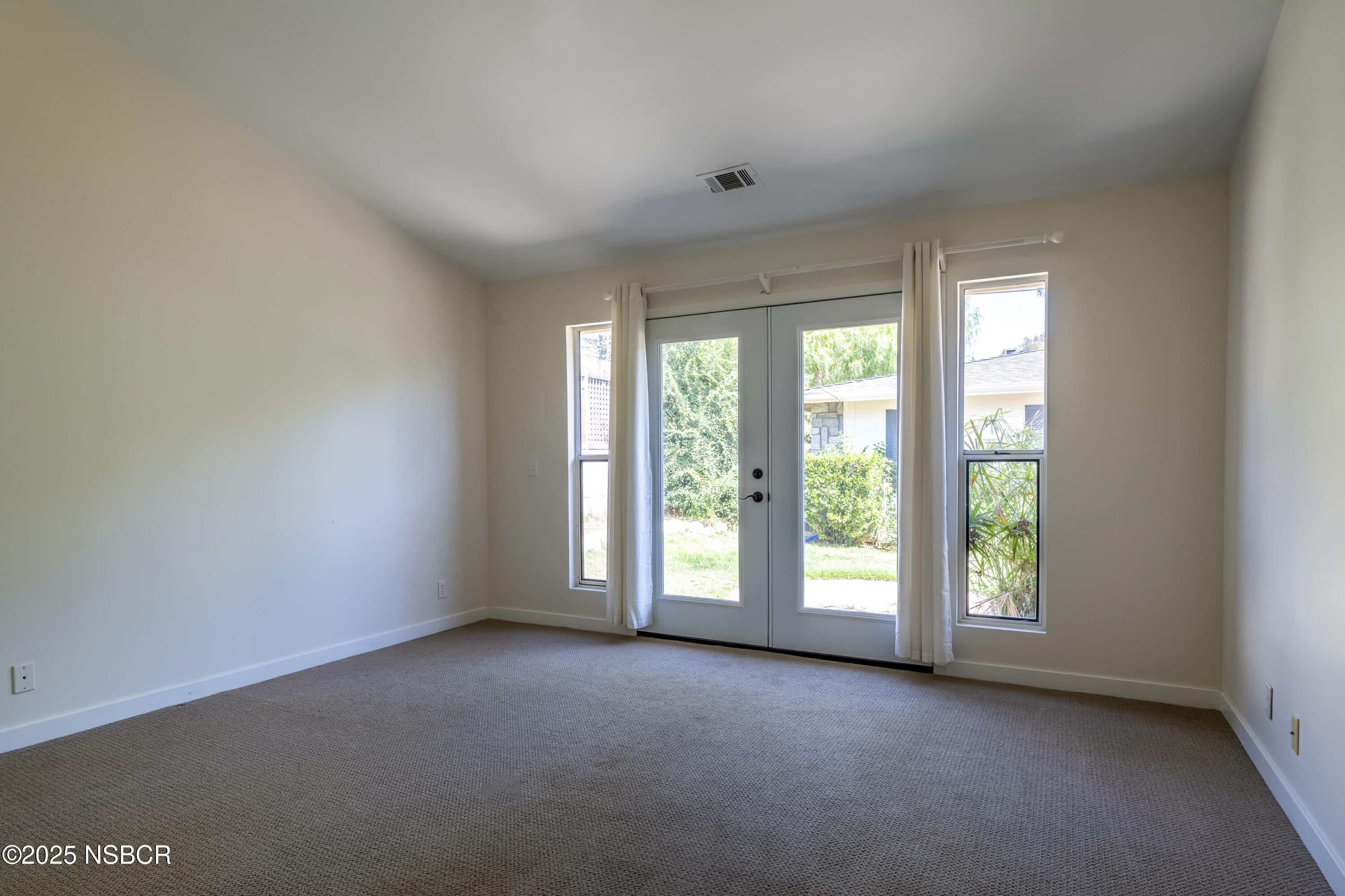 576 Pine Street, Unit A Solvang, CA 93463 - Photo 9 of 19 an empty room with windows