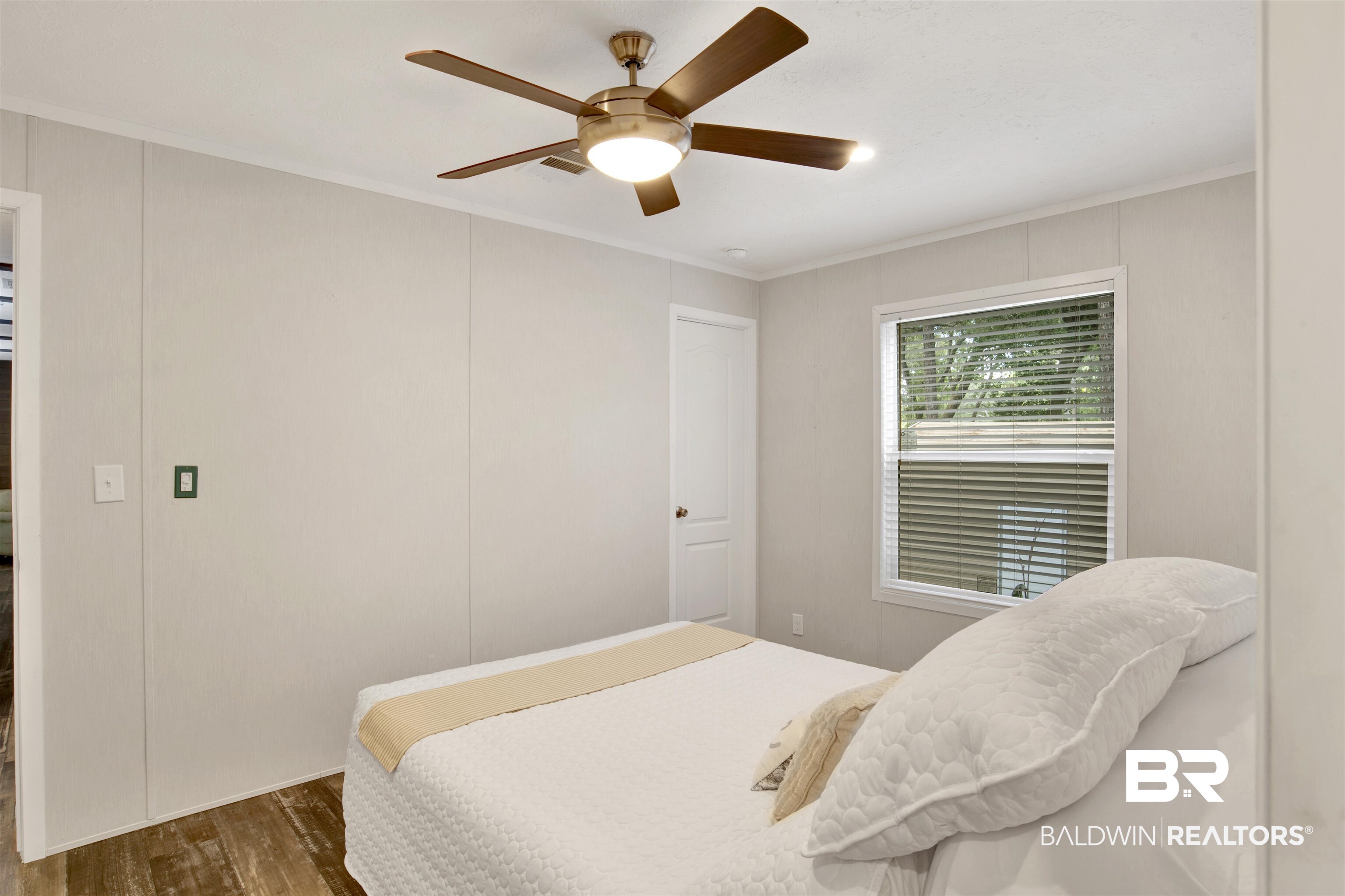 1411 Ridgewood Drive Lillian, AL 36549 - Photo 21 of 30 Bedroom featuring ornamental molding, dark wood-type flooring, and ceiling fan