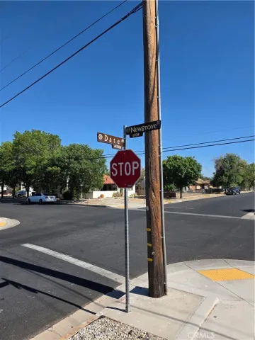 a view of a street with benches