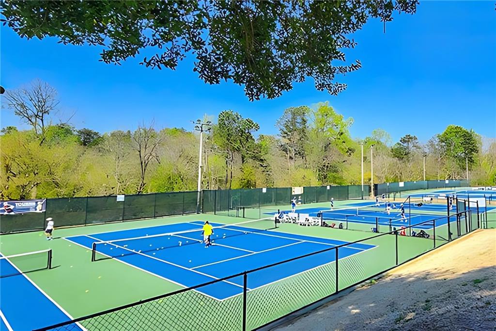 318 Sandy Springs Circle, Unit 310 Sandy Springs, GA 30328 - Photo 33 of 37 a view of tennis court with houses