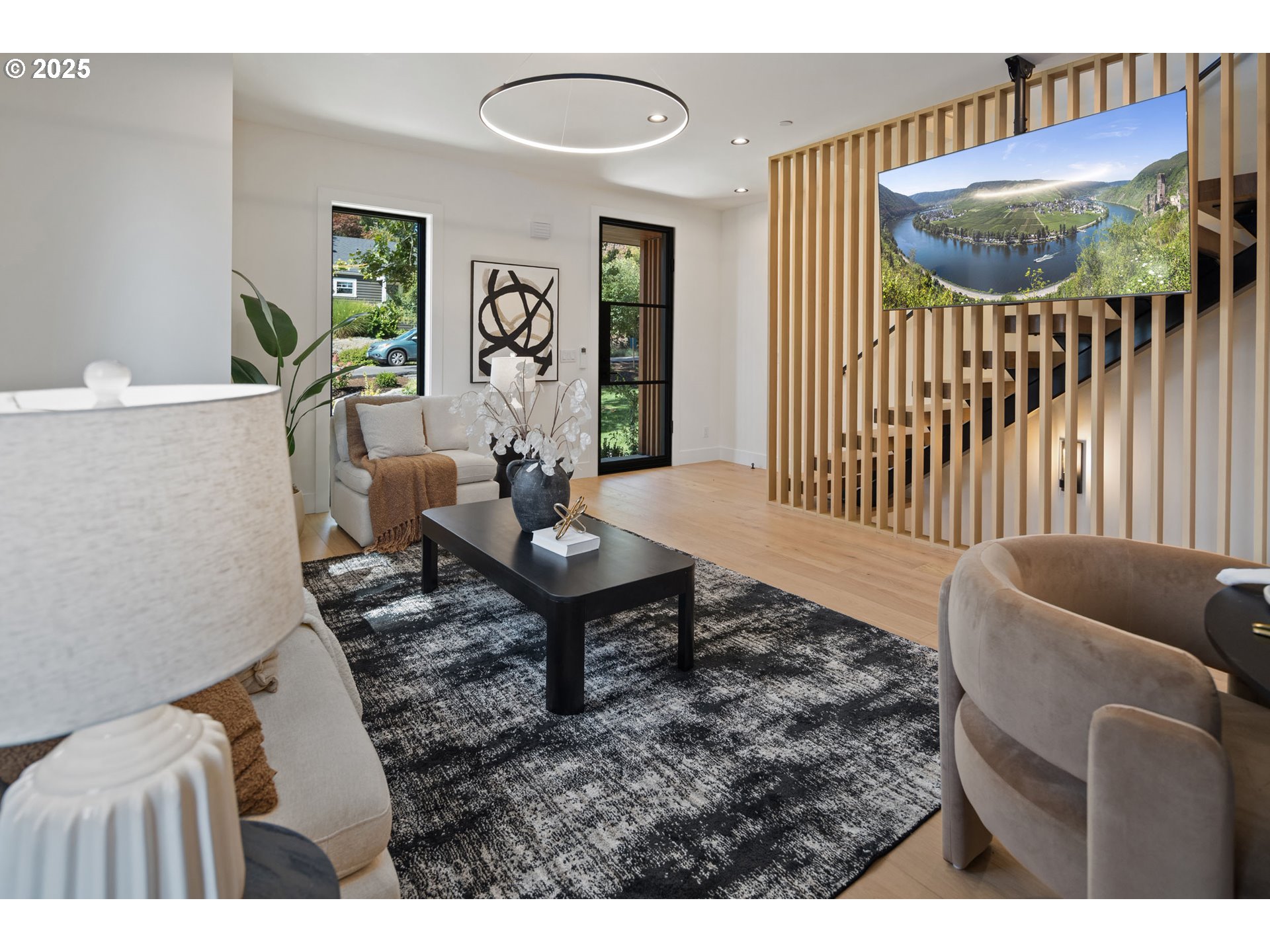 701 1st Street Lake Oswego, OR 97034 - Photo 12 of 42 a living room with furniture and a wooden floor