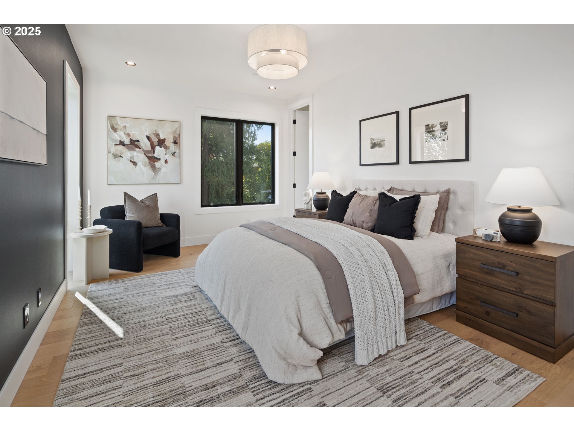 701 1st Street Lake Oswego, OR 97034 - Photo 20 of 42 a bedroom with a bed and wooden floor