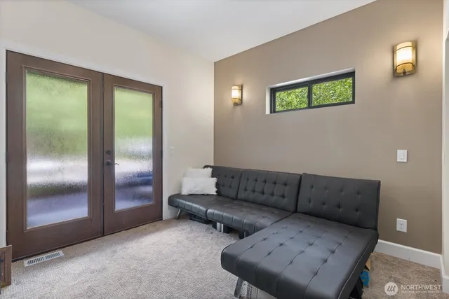 a living room with furniture and a window