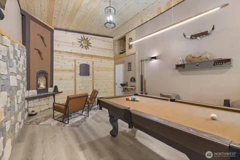 a room with table chairs and windows