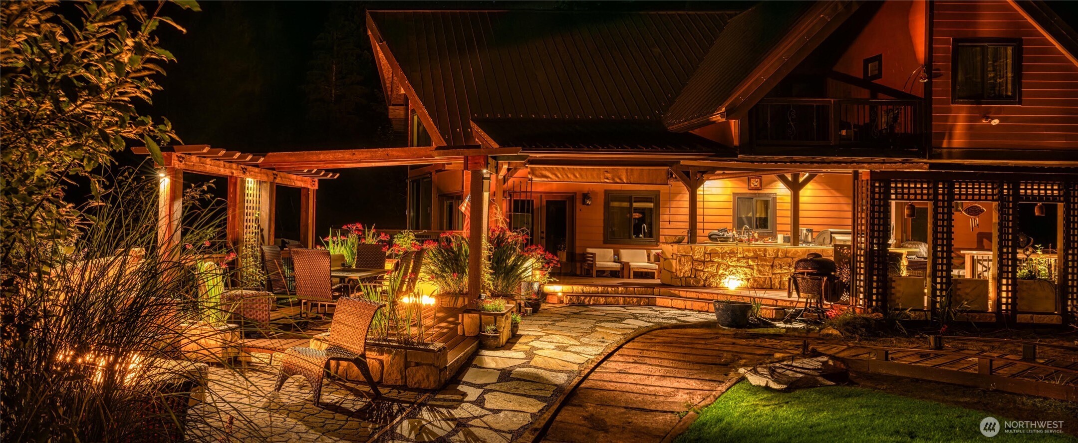 15305 Index-Galena Road Index, WA 98256 - Photo 23 of 38 a view of a patio with table and chairs with wooden floor and fence