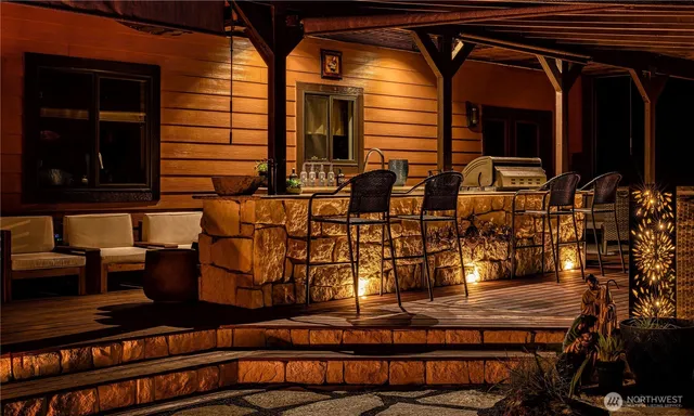 a view of a chairs and table in the patio