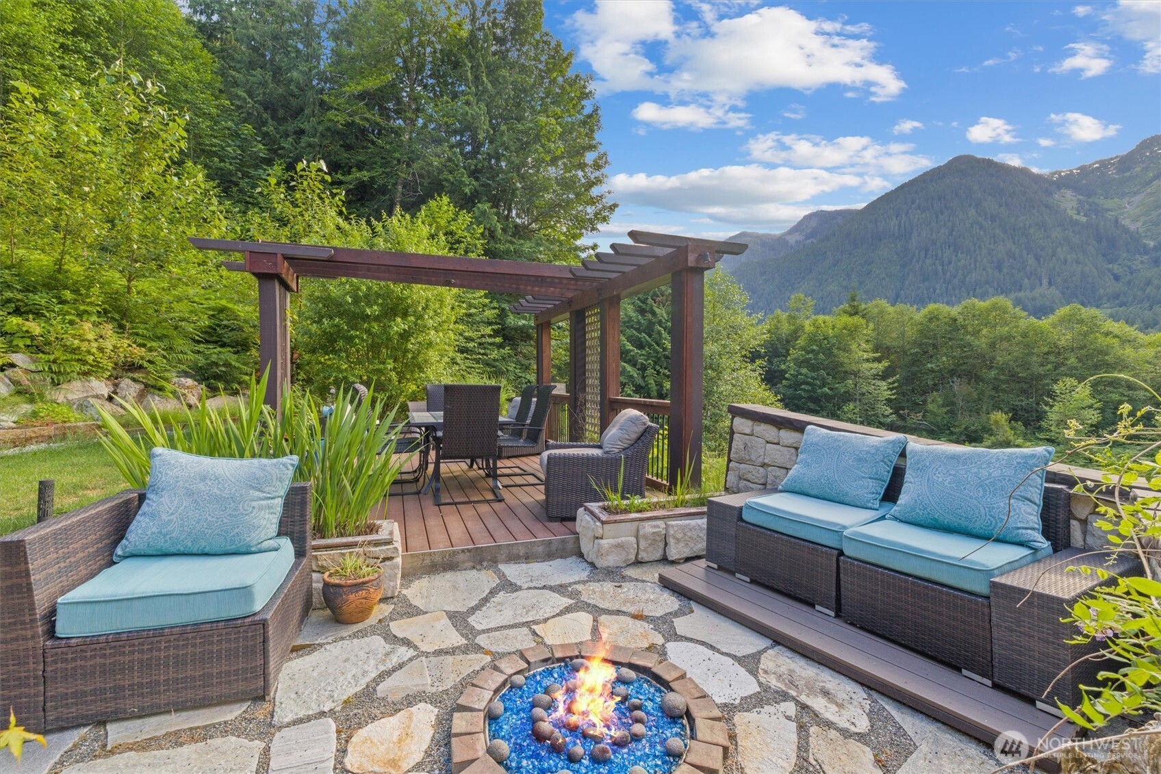 15305 Index-Galena Road Index, WA 98256 - Photo 28 of 38 a view of a patio with couches chairs and a fire pit