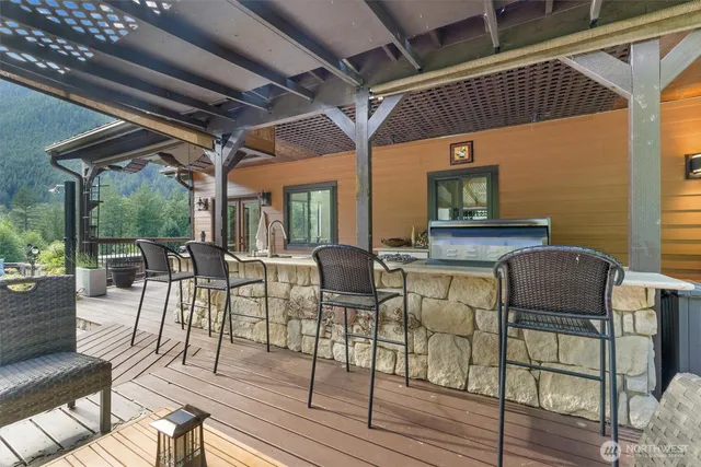 a view of a patio with table and chairs