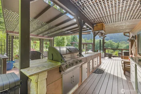 a outdoor patio with chairs and a table