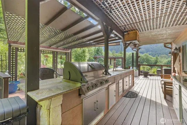 a outdoor patio with chairs and a table