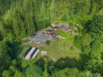 a view of a balcony with chair and wooden floor
