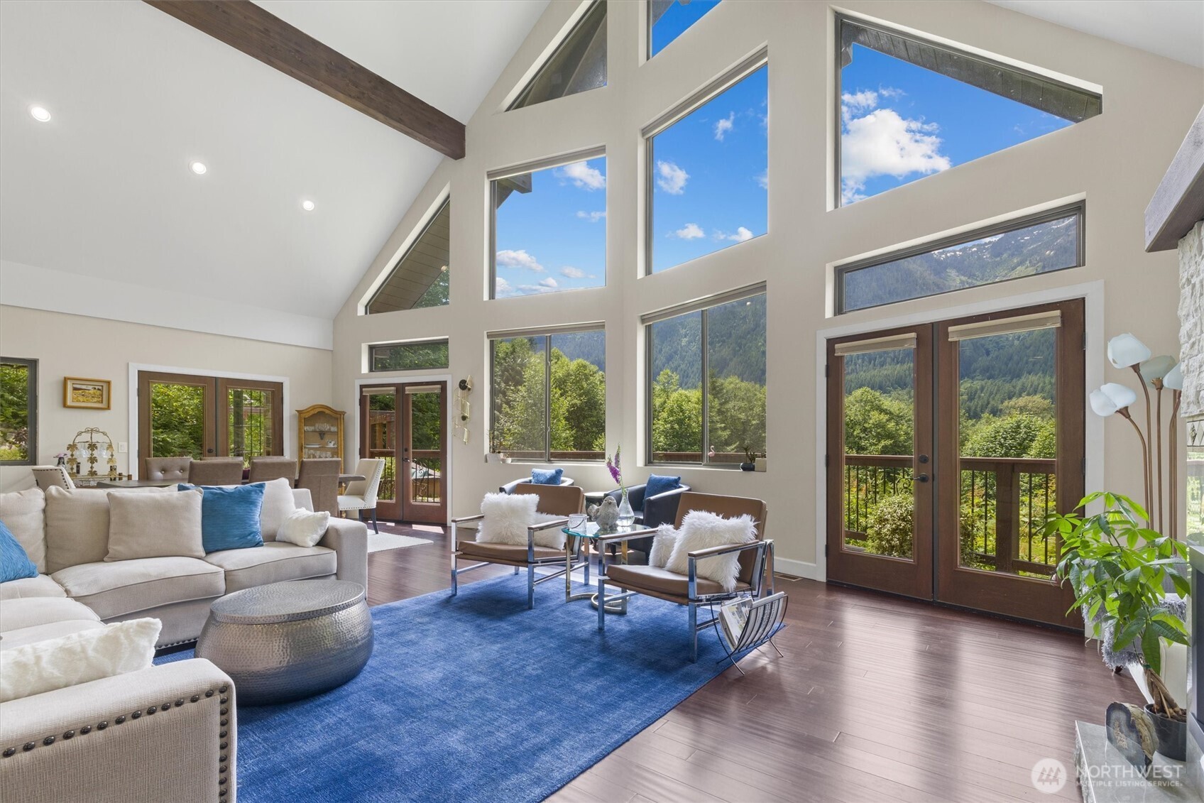 15305 Index-Galena Road Index, WA 98256 - Photo 4 of 38 a living room with furniture and a large window with outer view