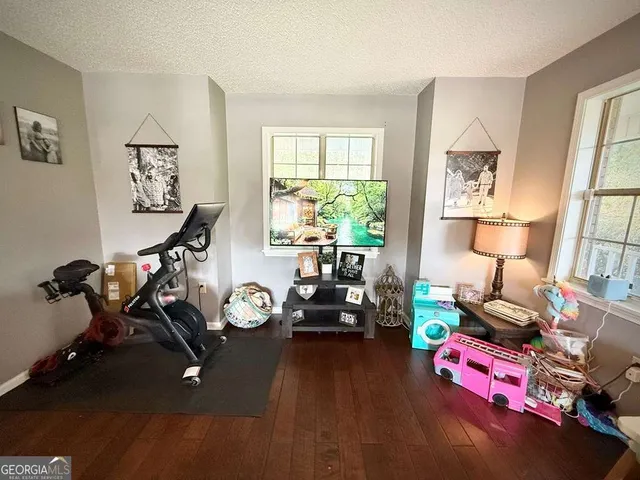 a view of a dining room with furniture window and wooden floor