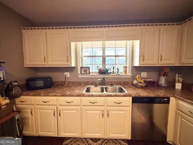 a spacious bedroom with a bed and window