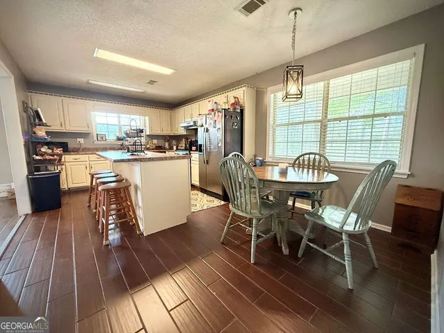 a bathroom with a sink and a window