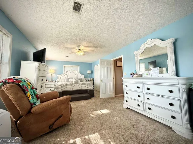 a view of a hallway view with staircase