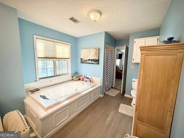 a room that has a chair and a wooden floor